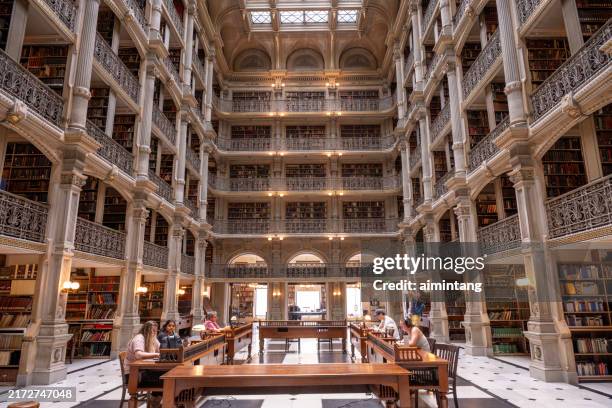 people reading inside peabody library - baltimore maryland stock pictures, royalty-free photos & images