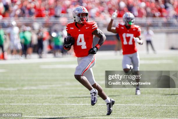 Ohio State Buckeyes wide receiver Jeremiah Smith carries the ball for a touchdown during the game against Marshall Thundering Herd and the Ohio State...