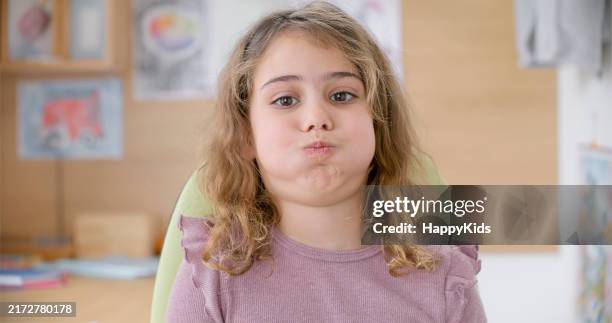 portrait of girl blowing cheeks - holding breath stock pictures, royalty-free photos & images