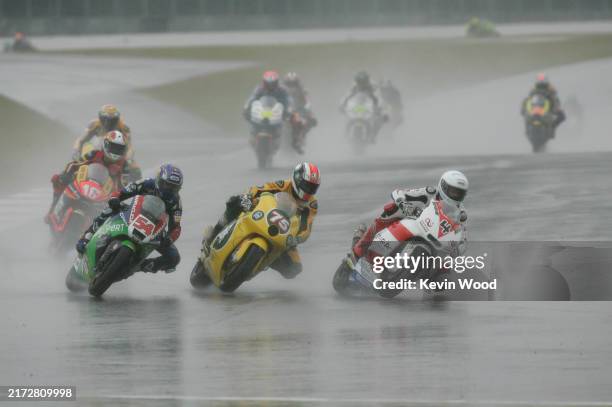 British Grand Prix. Moto2. Silverstone, England. 10th-12th June 2011. Randy Krummenacher, Kalex, passes Mattia Pasini, FTR, and Kenan Sofuoglu,...