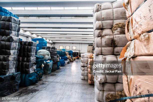 warehouse of a textile factory in florence where luxury fabrics are stored - loom stock pictures, royalty-free photos & images