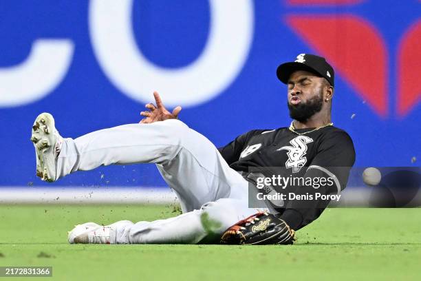 Luis Robert Jr. #88 of the Chicago White Sox can't make the catch on a double hit by Jurickson Profar of the San Diego Padres during the fifth inning...