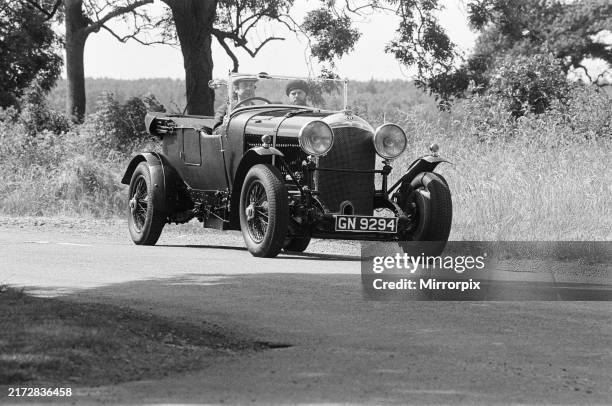 Nick at the wheel of a 1930 4.5 litre Bentley. 13th July 1984. Pop star Nick Mason, drummer with Pink Floyd, is swapping the bright lights of the...
