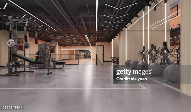 exercise equipment in a modern gym - gym stock pictures, royalty-free photos & images