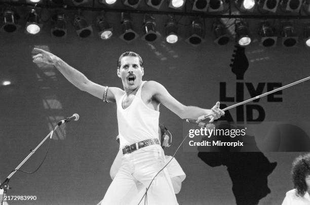 Live Aid. Wembley, London, England. Freddie Mercury leads his band Queen in a storming set that included the hits, Bohemian Rhapsody, Radio Ga Ga,...