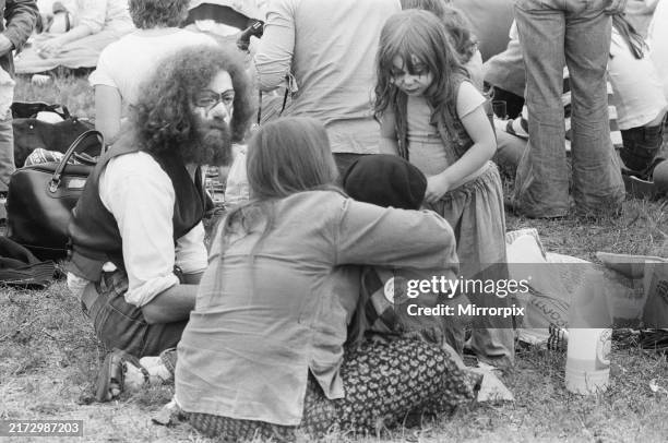 Family with clown face paint on, enjoying the afternoon Picture taken Saturday 15th July 1978. The huge crowd at Blackbushe Aerodrome, Yateley,...