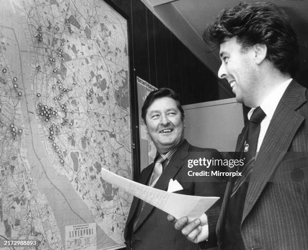 Transport director Mr Michael Burnett and assistant transport director, Mr Graham Wright, check some of the Higson's properties in the city area....