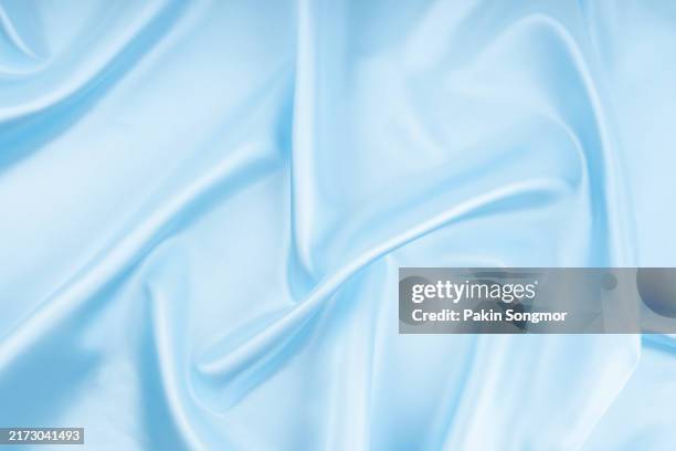 wave pattern light blue silk textile. abstract texture as background - satin sheets stock pictures, royalty-free photos & images