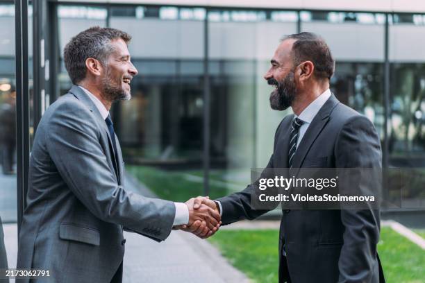 Front Handshake 516 Handshake In Front Of Building Stock Photos, High-Res Pictures, and ...