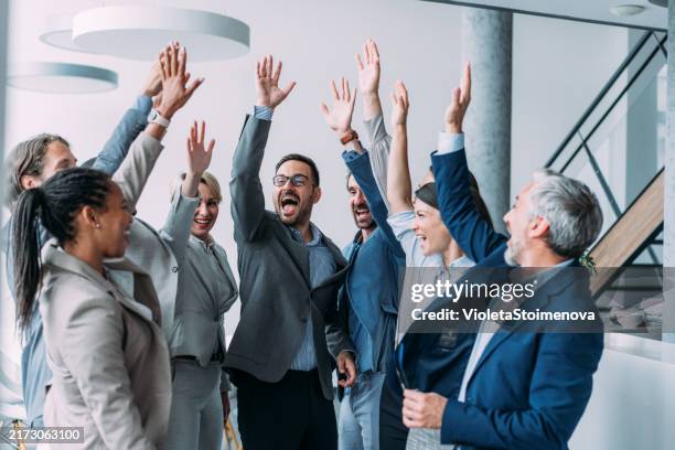 motivating the team. - high five office stock pictures, royalty-free photos & images