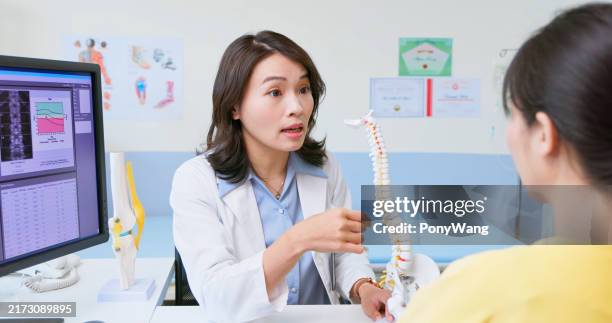 doctor explain bone mass density - bone density stock pictures, royalty-free photos & images