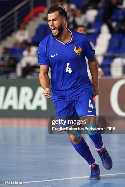 Nicolas Menendez of France celebrates scoring his team's first goal during the FIFA Futsal World Cup Uzbekistan 2024 match between France and...