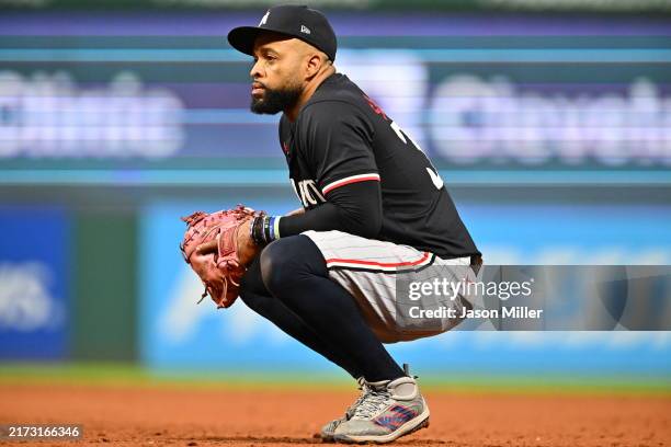 First baseman Carlos Santana of the Minnesota Twins pauses between plays during the ninth inning against the Cleveland Guardians at Progressive Field...