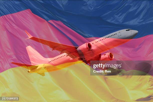 white passenger aircraft with german national flag overlay - aeroplane part stock pictures, royalty-free photos & images