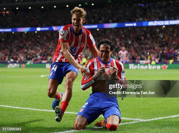 Jose Gimenez of Atletico de Madrid celebrates scoring his team's second goal with teammate Marcos Llorente during the UEFA Champions League 2024/25...