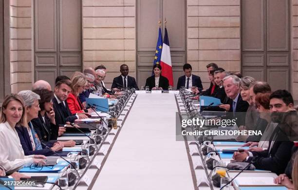 French President Emmanuel Macron and French Prime Minister Michel Barnier meet with members of the new government during the weekly cabinet meeting...