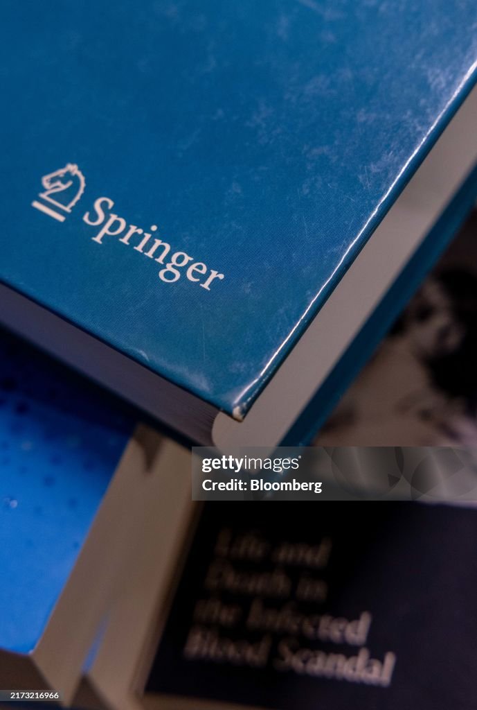 Springed Books The Springer logo on an academic book arranged in London, UK, on ...