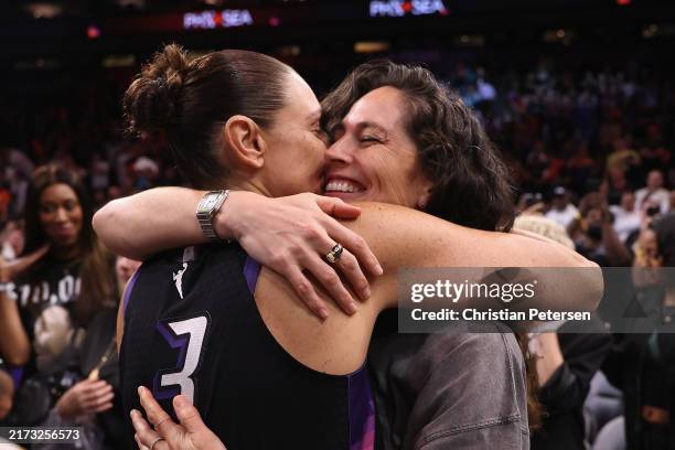Diana Taurasi of the Phoenix Mercury hugs former professional player Sue Bird following the WNBA game against the Seattle Storm at Footprint Center...