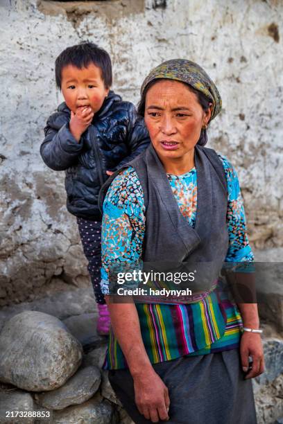 young tibetan woman with her baby girl, upper mustang - nepal children stock pictures, royalty-free photos & images