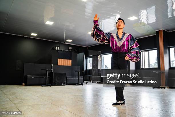 young man dancer dancing in a ballroom - colombian people stock pictures, royalty-free photos & images