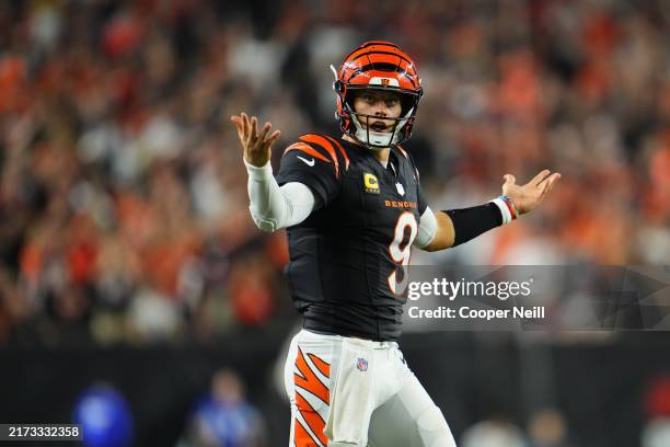 Joe Burrow of the Cincinnati Bengals reacts after a play against the Washington Commanders during the second half of an NFL football game at Paycor...