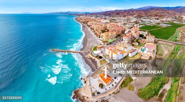 faro de torrox lighthouse in torrox costa in malaga costa del sol in andalusia of spain - torrox stock-fotos und bilder