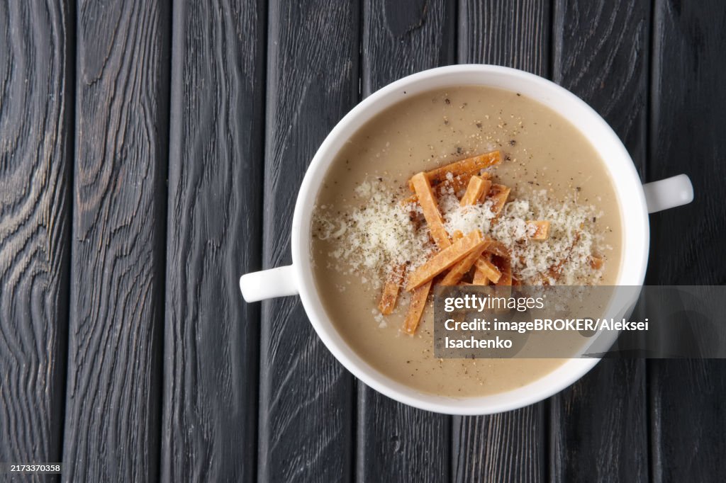 Top view of mushroom soup puree with chips