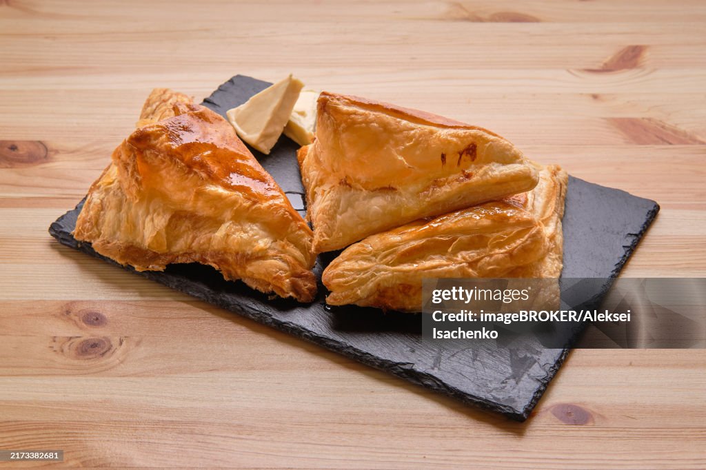 Puff pastry with cheese on slate plate