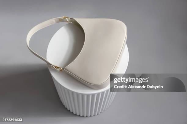 fashionable women's bag lying on the catwalk. concept fashion - beige purse stock pictures, royalty-free photos & images