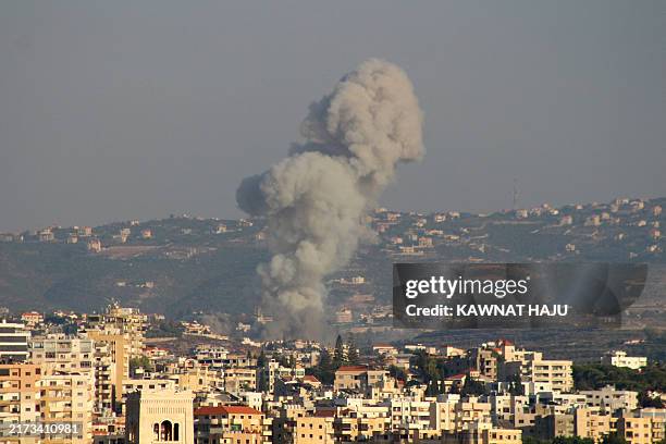 Smoke billows after an Israeli airstrike that targeted the southern Lebanese village of Abbasiyeh on September 24, 2024. Israel announced dozens of...