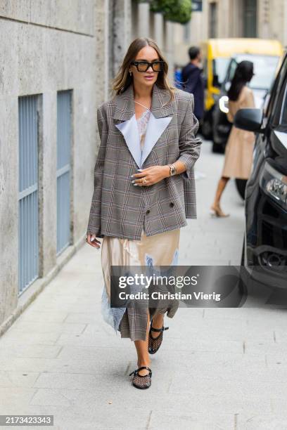 Nina Suess wears grey checkered blazer, beige laced dress outside Sportmax during the Milan Fashion Week Menswear Spring/Summer 2025 on September 20,...