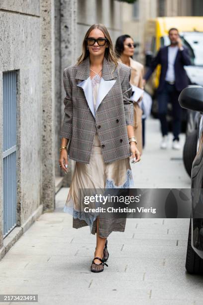 Nina Suess wears grey checkered blazer, beige laced dress outside Sportmax during the Milan Fashion Week Menswear Spring/Summer 2025 on September 20,...