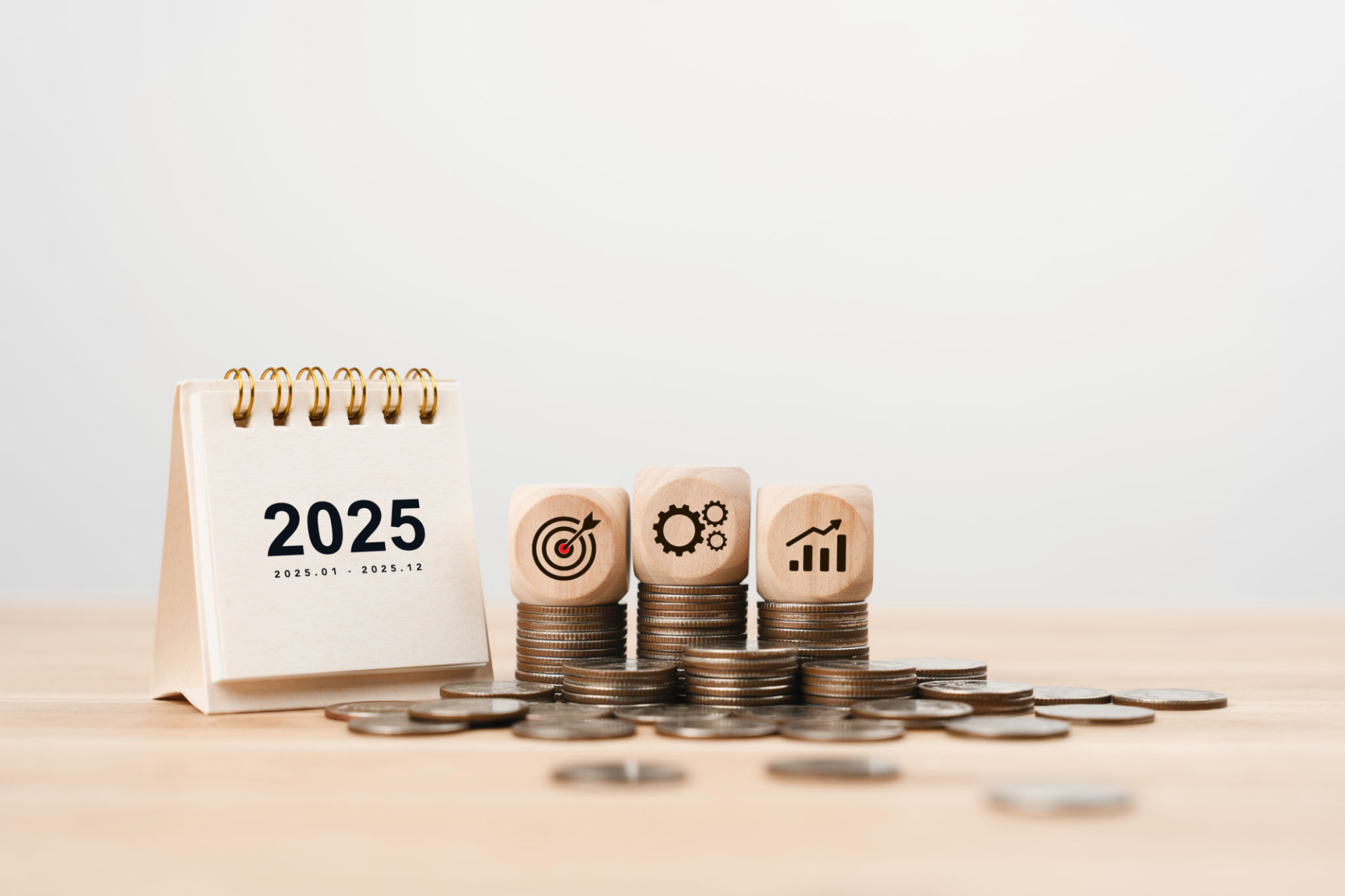 2025 Calendar and wooden cube with goal plan action icon on growth coin. New year resolution of finance investment concept. financial annual plan for save money, Budget, tax, financial and savings 2025 Calendar and wooden cube with goal plan action icon on growth coin. New year resolution of finance investment concept. financial annual plan for save money, Budget, tax, financial and savings