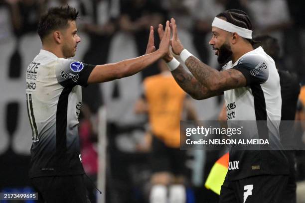 Corinthians' Paraguayan forward Angel Romero celebrates with teammate Dutch forward Memphis Depay after scoring during the Copa Sudamericana...