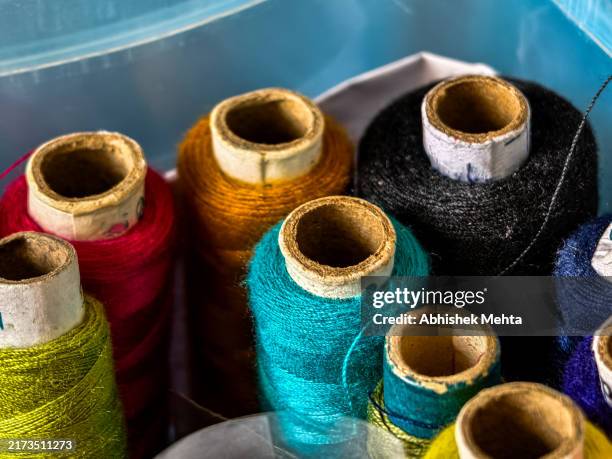 colored sewing threads - thread stock pictures, royalty-free photos & images