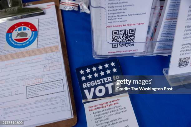 Informational materials and voter registration forms on the table at a volunteer-run voter registration booth on the campus of Morehouse College in...