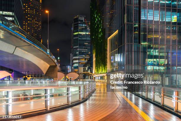 modern pedestrian walkway in tokyo at night - elevated walkway stock pictures, royalty-free photos & images