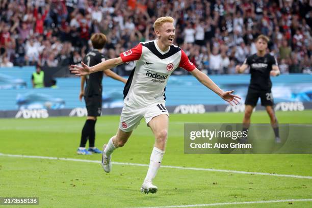 Hugo Larsson of Eintracht Frankfurt celebrates scoring his team's first goal during the Bundesliga match between Eintracht Frankfurt and Borussia...