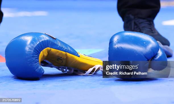 Detailed view of Josh Warrington gloves after he threw them down as he reacts to defeat to Anthony Cacace in the IBO World Super Featherweight Title...