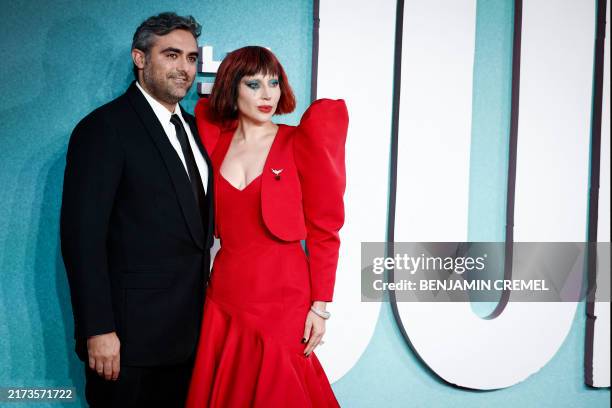 Singer-songwriter and actor Lady Gaga poses on the red carpet with her Fiance Michael Polansky upon arrival to attend the the UK premiere of "Joker:...