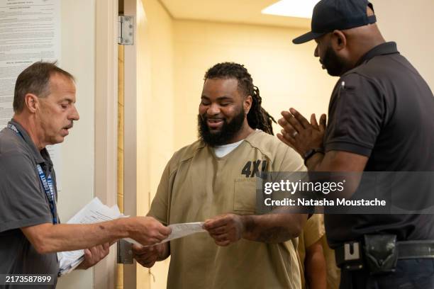 Inmates attend a performance by the Bacon Brothers at Cook County Jail on September 21, 2024 in Chicago, Illinois.