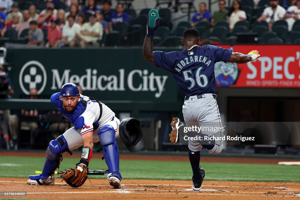 Seattle Rangers Carson Kelly of the Texas Rangers gets the ball late as Randy... News ...