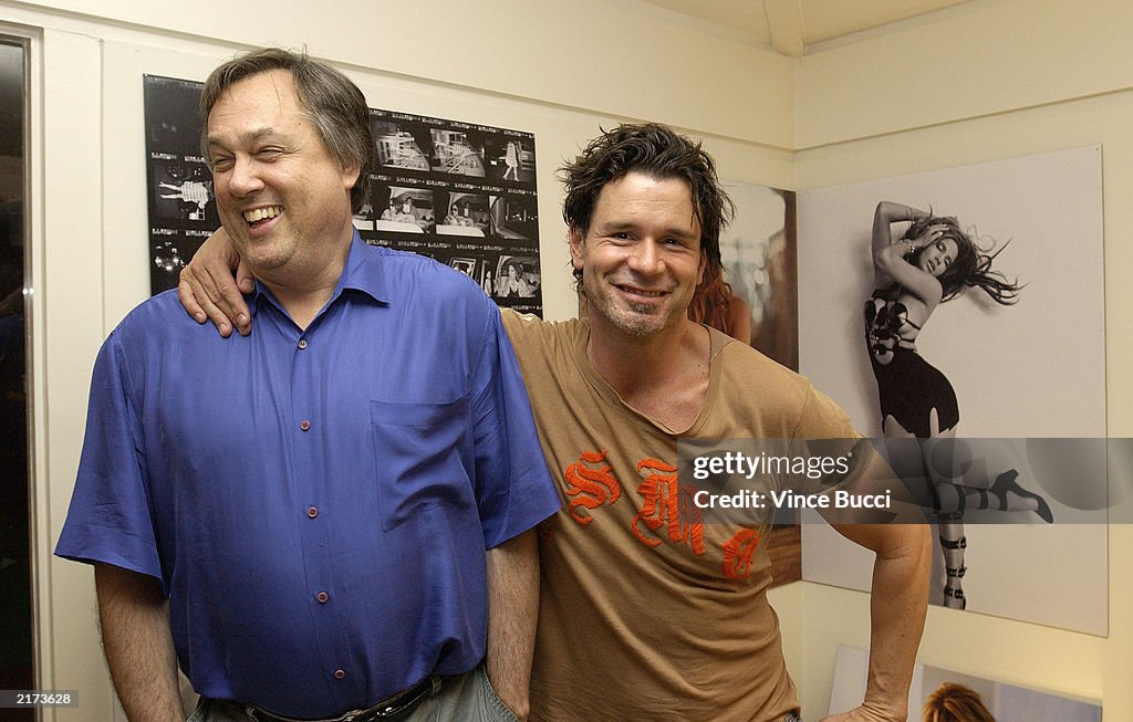 Publisher Richard Rabinowitz and photographer Tony Duran stand next ...