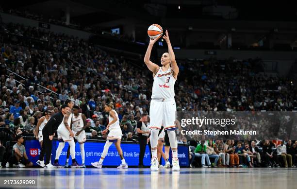 Diana Taurasi of the Phoenix Mercury shoots a free throw after a defensive three seconds violation by the Minnesota Lynx in the first quarter in Game...