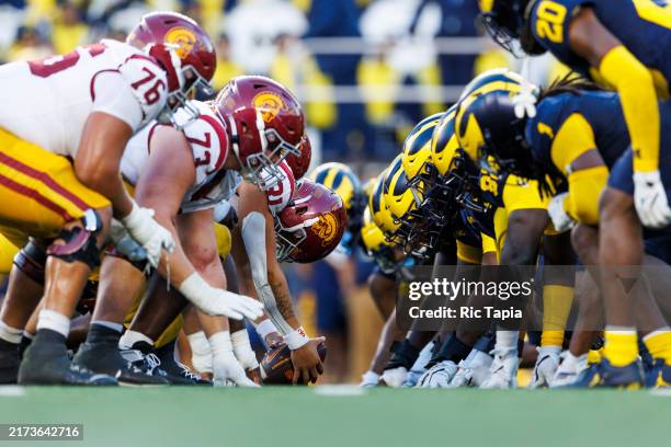 Trojans offense and Michigan Wolverines defense at the line of scrimmage before an extra point attempt during the second half at Michigan Stadium on...