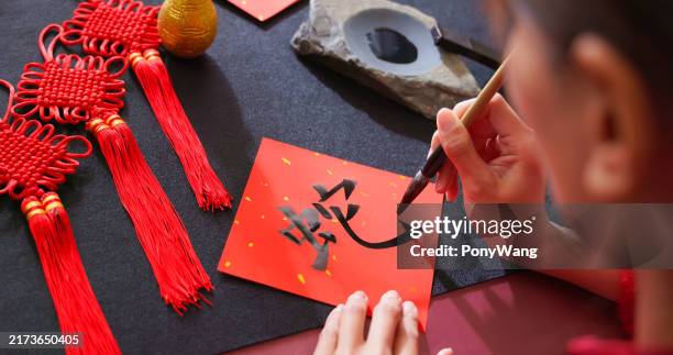writing spring festival couplet - caligrafia imagens e fotografias de stock