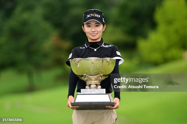 Yuka Yasuda of Japan poses with the trophy after winning the tournament following the final round of 51st Miyagi TV Cup Dunlop Ladies Open Golf...