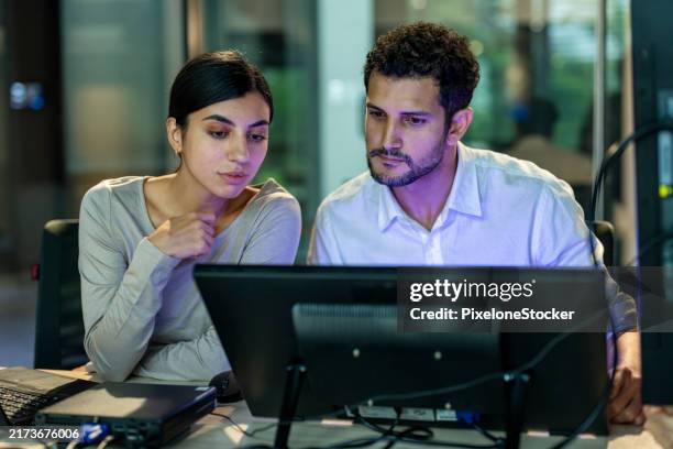 two software developers checking programming code on computer screen. - softwareentwicklung stock-fotos und bilder