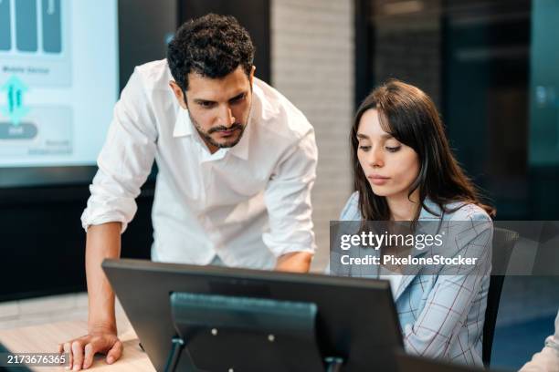 two software developers checking programming code on computer screen. - chat screen stock pictures, royalty-free photos & images
