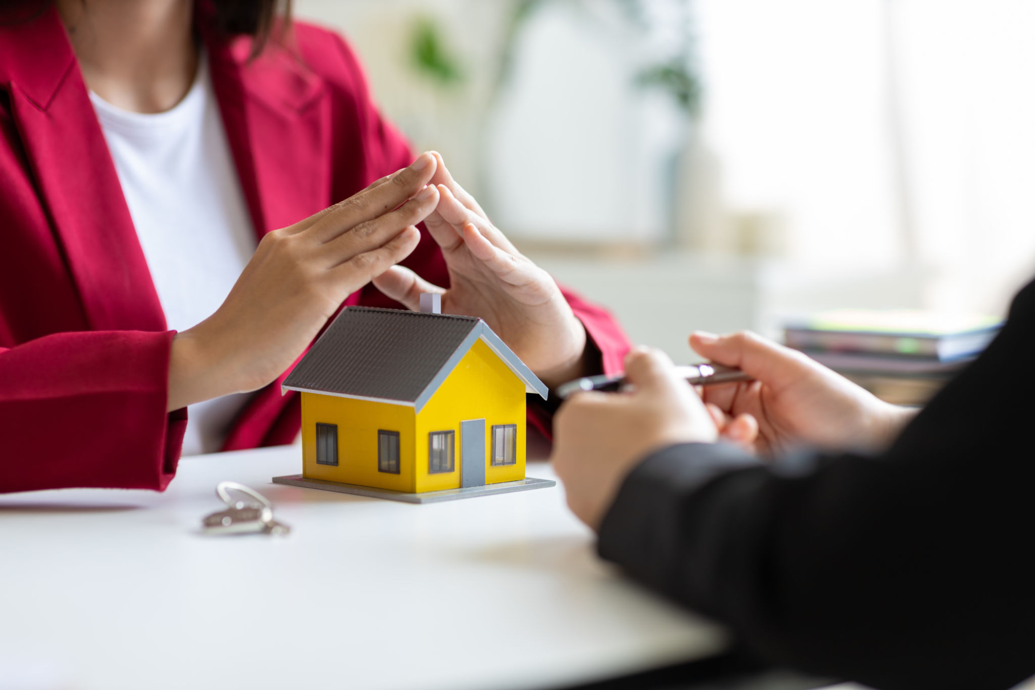 Real estate agents provide home insurance advice and signing home sales contracts to clients. Real estate agents provide home insurance advice and signing home sales contracts to clients.